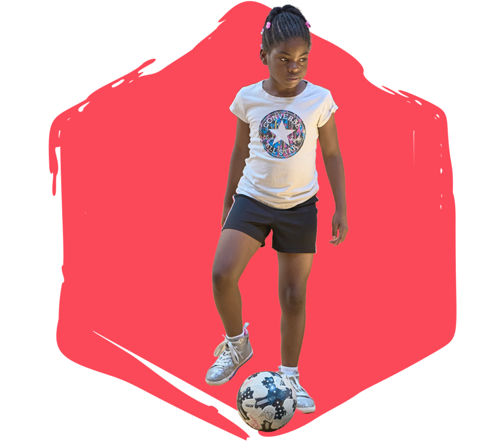Girl standing with a soccer ball